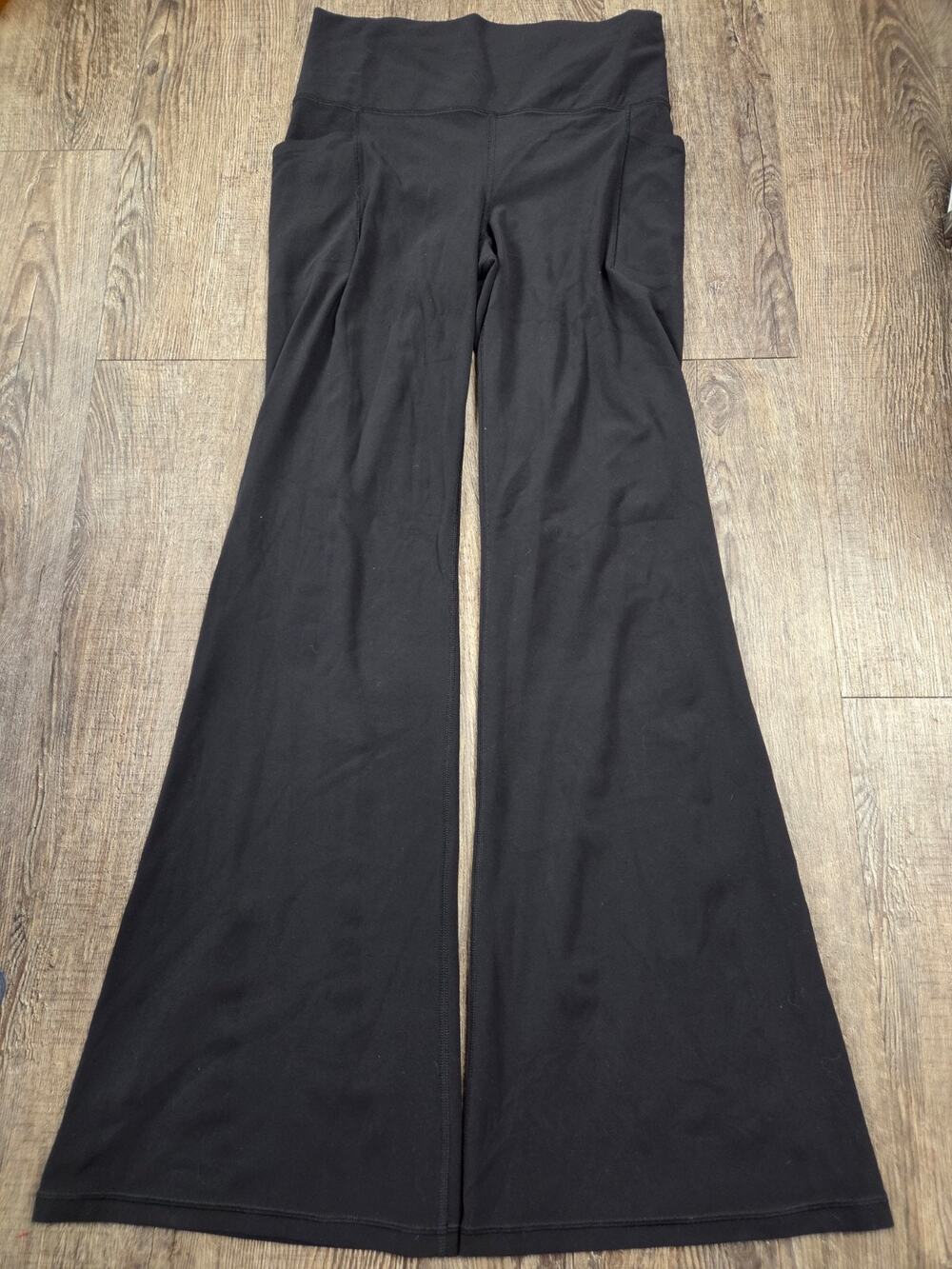 Athleta Salutation Stash Flare Pant In Black Medium Athlesiure Yoga Casual